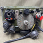 Vintage electronic device with dials and connectors on a beige background