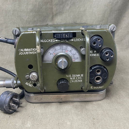 Vintage military radio receiver on a textured surface