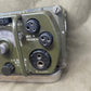 Vintage radio receiver with multiple connectors on a beige background