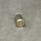 Bullet casing on a concrete surface
