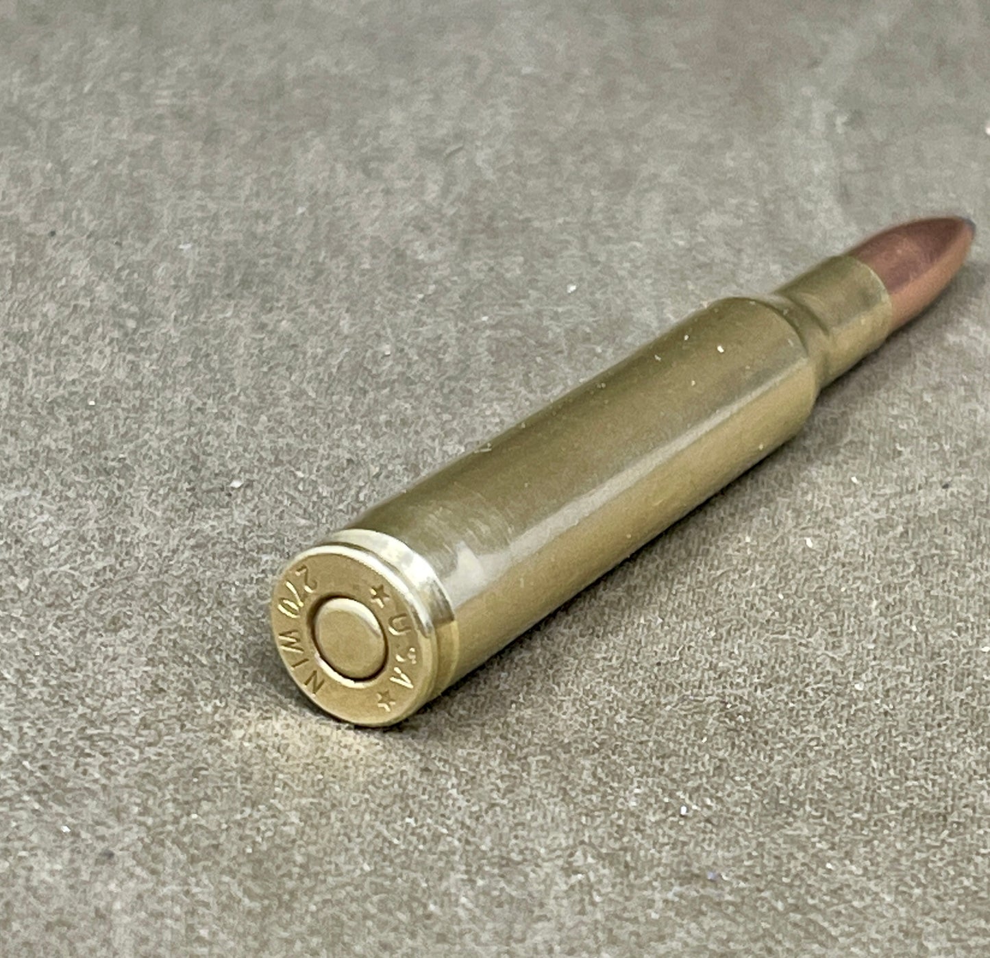 Bullseye bullet on a gray surface