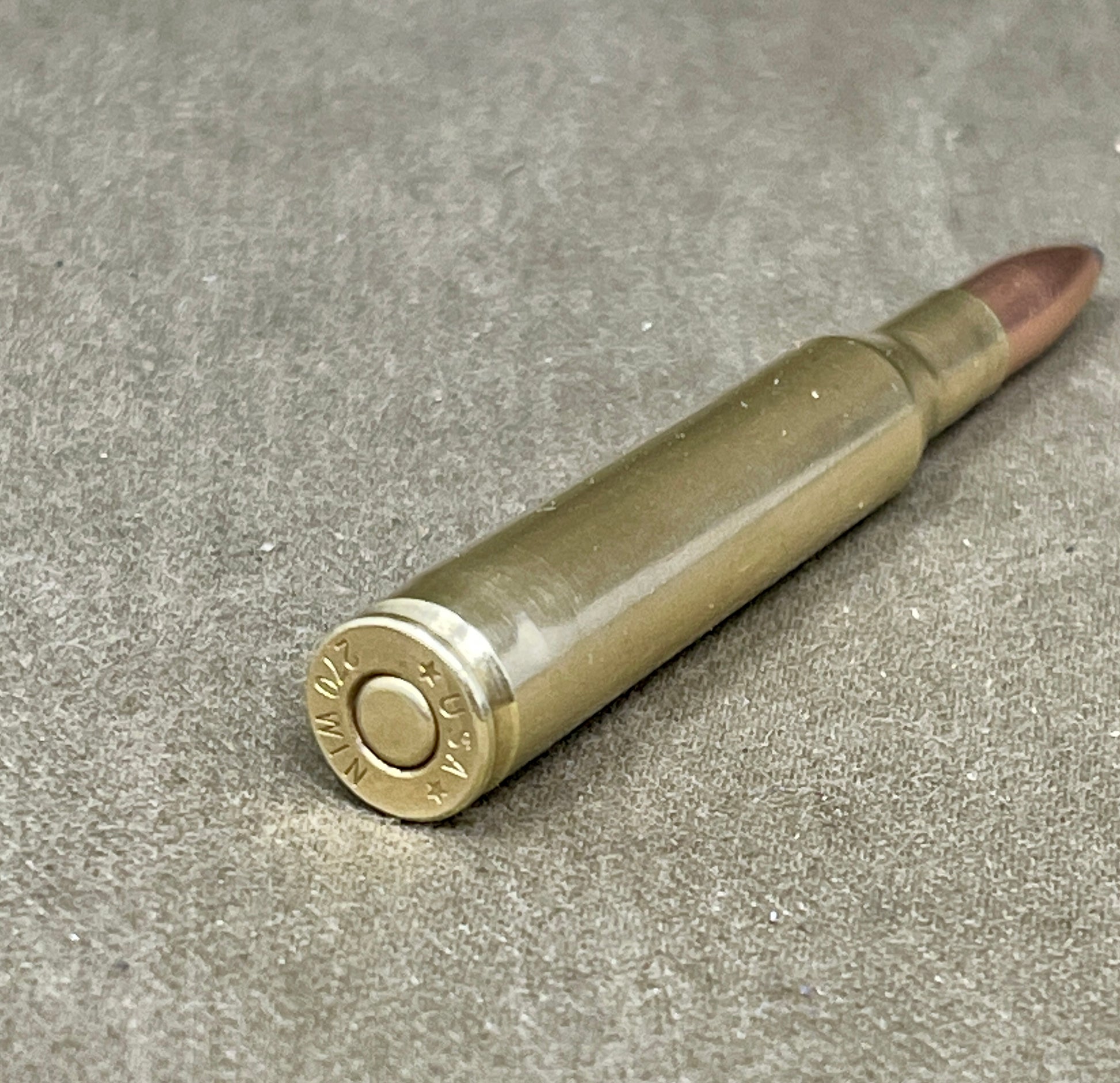 Bullseye bullet on a gray surface