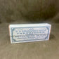 Box of U.S. Springfield rifle cartridges on a brown background