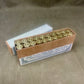 Box of ammunition on a textured surface
