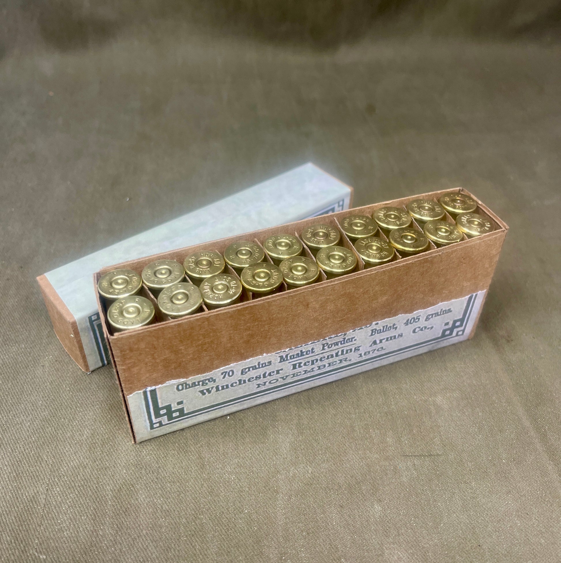 Box of ammunition on a textured surface
