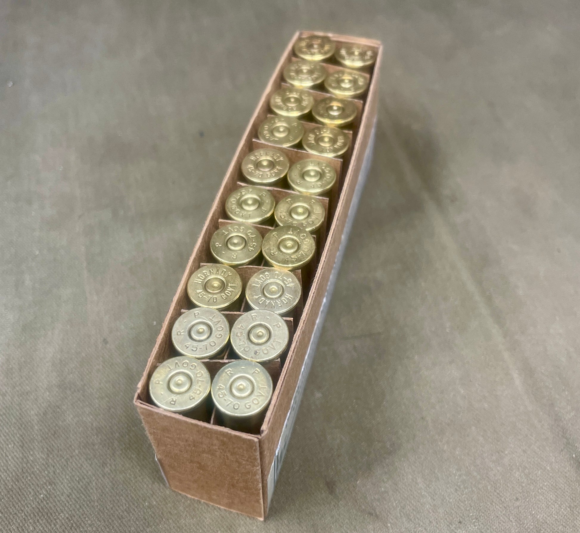 Box of shotgun shells on a gray background