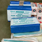 Paragon plain wound dressings stacked on a brown surface