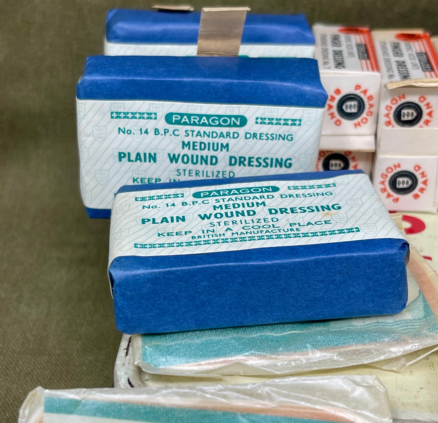 Paragon plain wound dressings stacked on a brown surface