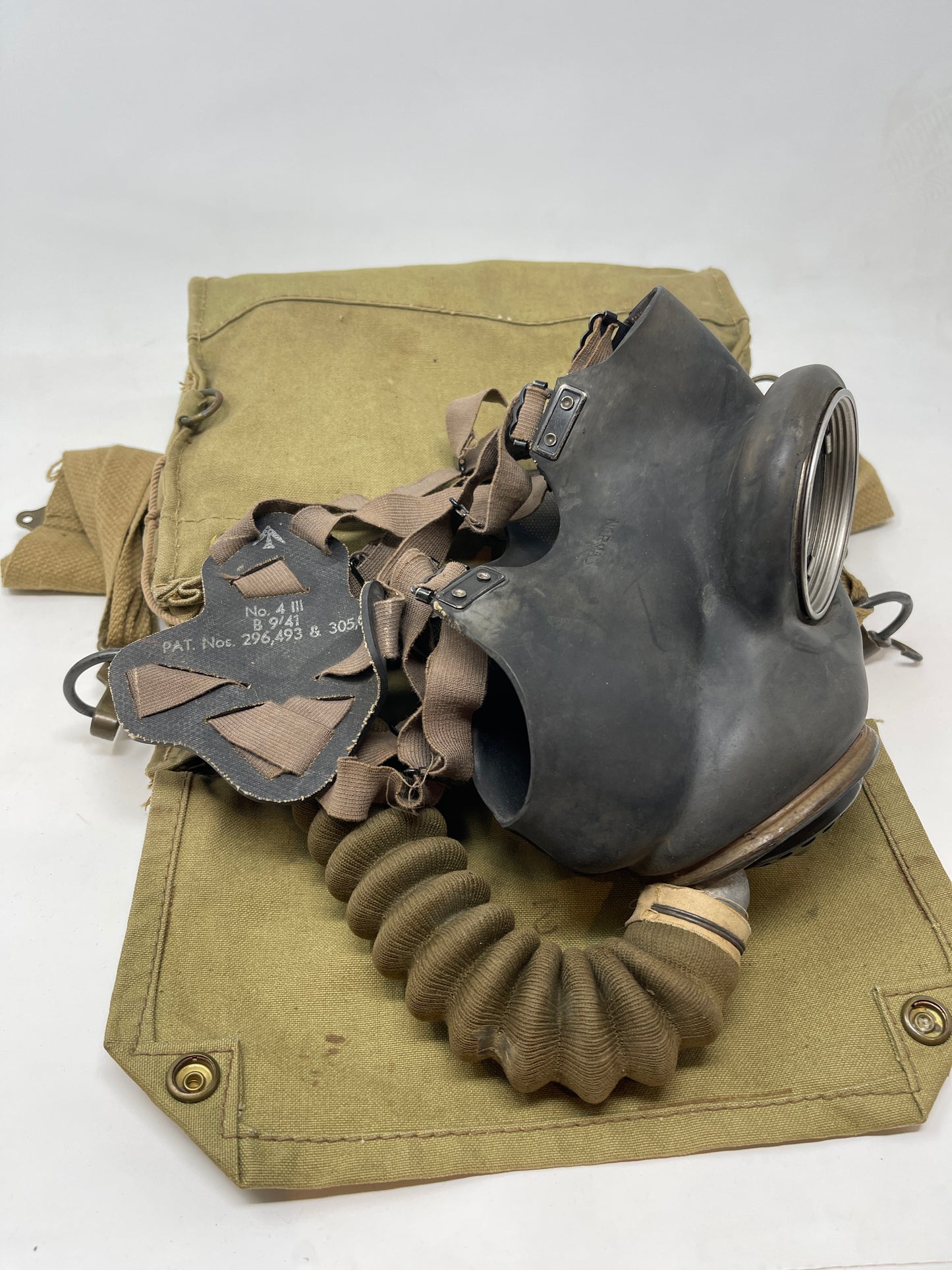 British General Service Respirator (GSR) gas mask on top of case