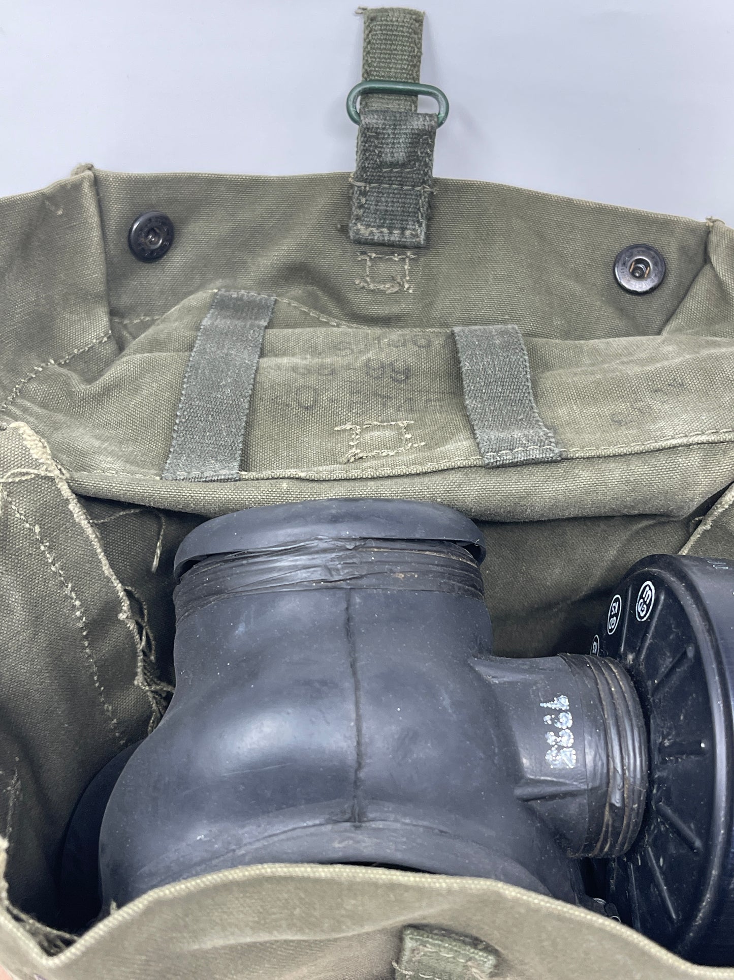 image shows inside of 1960's British Army S6 Gas Mask & Haversack showing S6 respirator next to bag