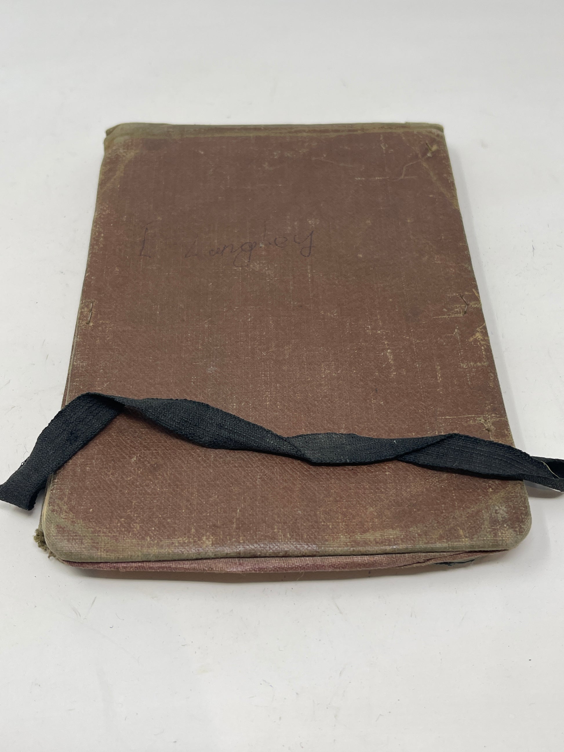 The book contains handwritten notes relating to the Vickers Machine Gun  Army Book 153 is the Army issue notebook that was issued to Officers and NCOs to keep in their pockets when on active service.  The notebook contains a hardback cover with a brown waterproof fabric  Elastic strap to keep the book closed   removable paper notepad