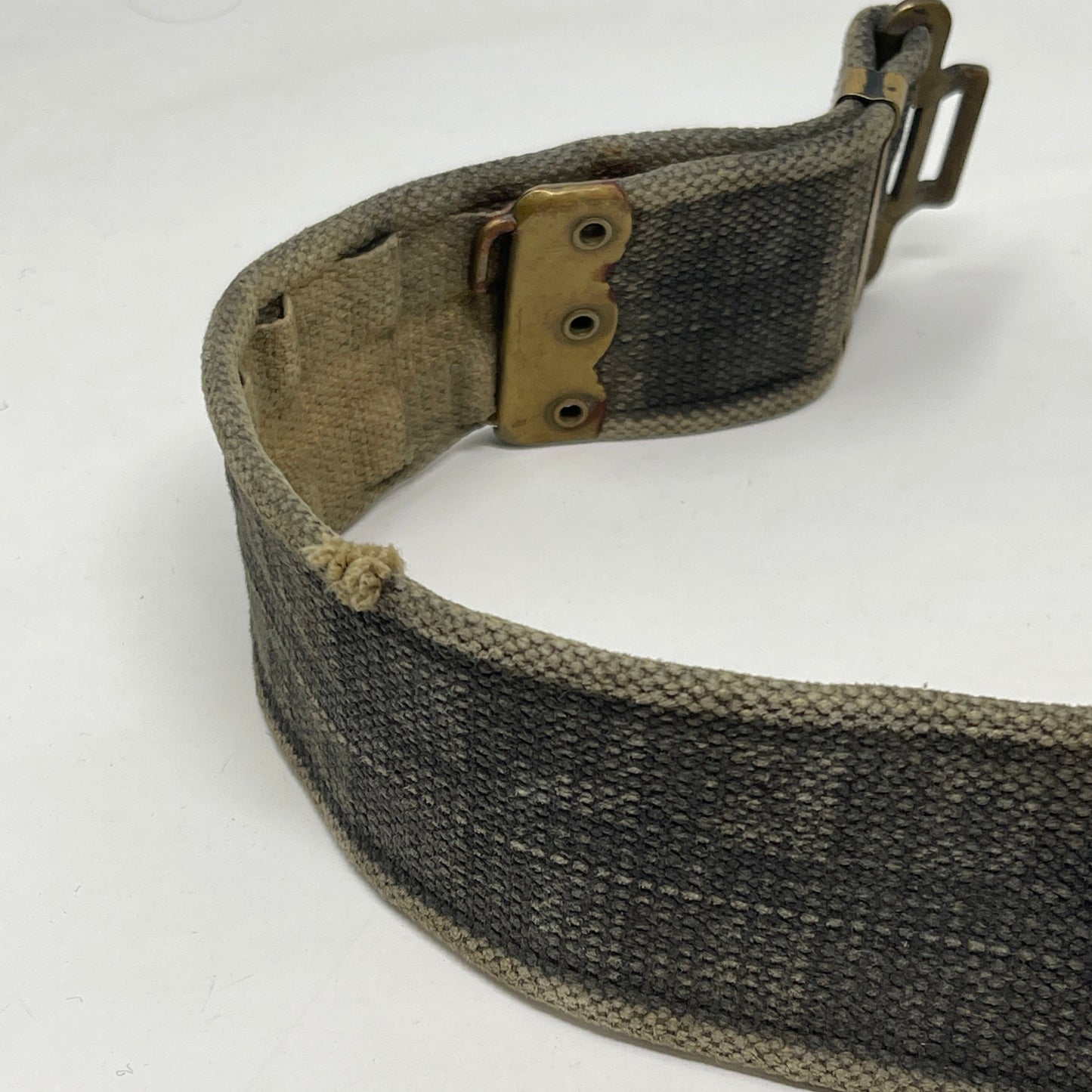 image showing left side brass buckle of webbing belt