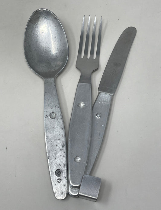 Knife, fork, and spoon set dated 1944