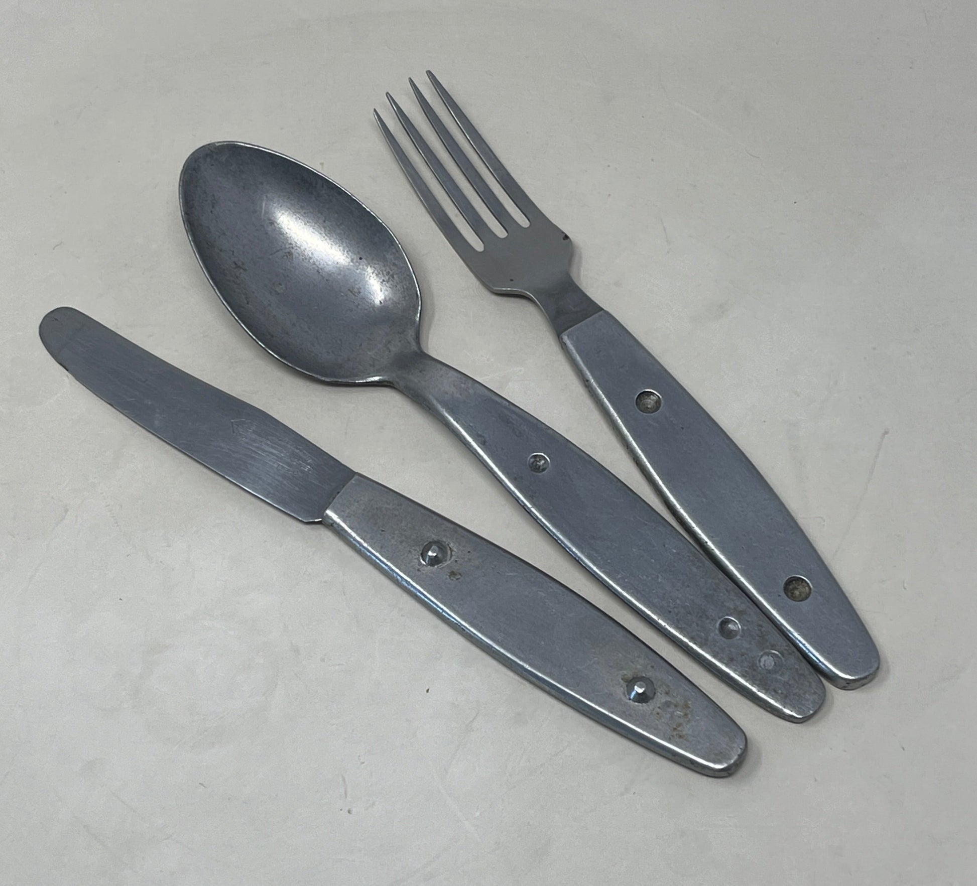 Knife, fork, and spoon set dated 1944